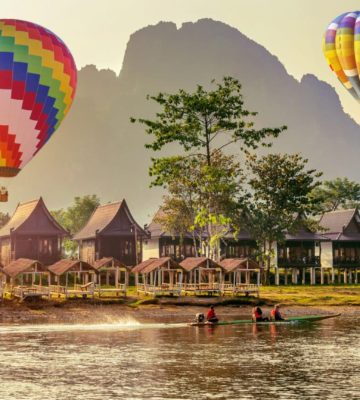 Hot air balloon over Nam Song river at sunset in Vang vieng, Lao